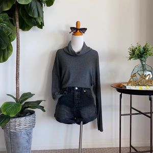 Charcoal grey turtleneck knit top.